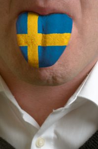 3701935-man-tongue-painted-in-sweden-flag-symbolizing-to-knowledge-to-speak-foreign-language